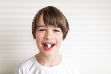 portrait of a child with pill. Medicine concept