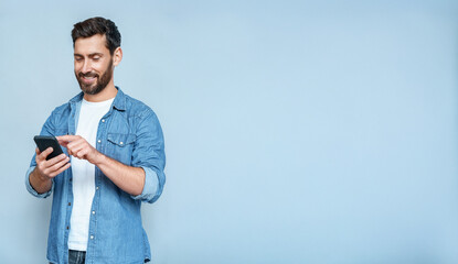 Banner portrait of handsome 30s 40s old businessman using telephone mobile cellphone. Mature...