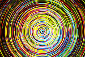 Neon circle lines with empty copy space inside isolated on black background. Colorful led lights long exposure rotation photo. Shiny light source. Cosmos space planet abstraction. Vortex spiral design