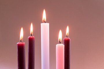 5 advent candles, pink, purple and white colors, isolated, 5 five candles burning