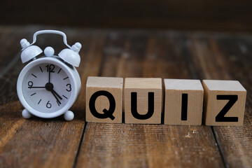 the words Its Quiz Time on wooden block. the concept of answering quizzes or quiz games
