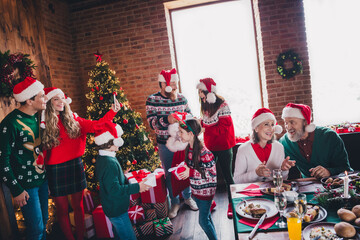 Photo of group family members have fun gather celebrate christmas apartment indoors