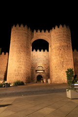 Gate of The Alcazar of the walls at night in Avila city