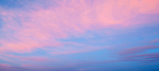 Sunset sky background, panoramic view of colorful sunset sky of blue and pink colors. Vast sunset...