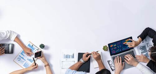 Group of office worker and businesspeople working on business financial data analysis. Empty space with editable blank background meeting table for customer design. Prudent