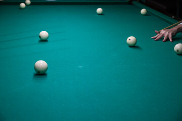 Sports game of billiards on a green cloth