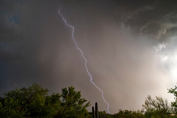 Late day monsoon storm with lightning over the sonoran desert