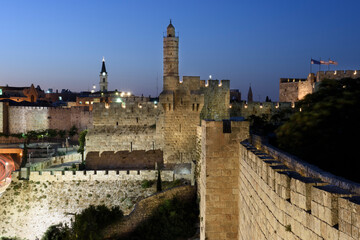 Twilight view of the landmark, stone Tower of David citadel  and ancient walls of the Old City of Jerusalem. © Yehoshua Halevi