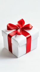 Fototapeta premium A small Valentine’s gift with a red bow sits beautifully wrapped on a white background