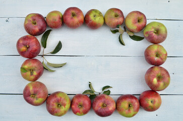 fall apple frame on a white wooden table