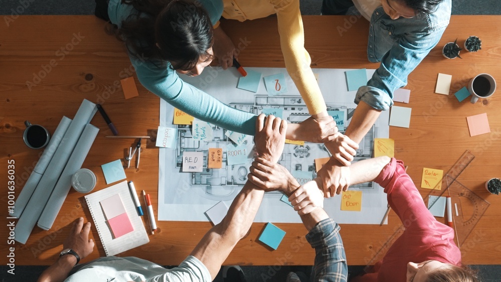 Poster top down view of business people working together and holding wrist. aerial view of architect engine