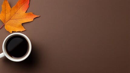 cozy autumn background with cup of coffee with space for text