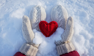 Winter Themed Marketing, Red Knitted Heart Held by Gloved Hands in Snowy Environment, Cozy, Warmth, Winter, Love, Holidays, Handmade, Cold Weather, Valentine's Day, Festive