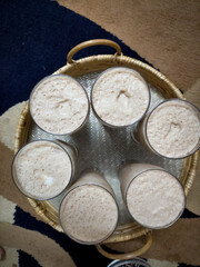 Very Delicious drinks named lacchi presented in a tray made by cane