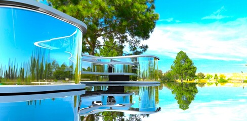 A century-old pine tree reflects on the perfectly smooth surface of the lake behind a stunning glass property. 3D rendering.