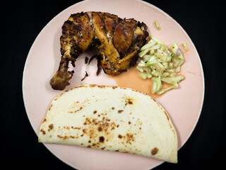 South asian traditional breakfast contained chicken ,bread and salad