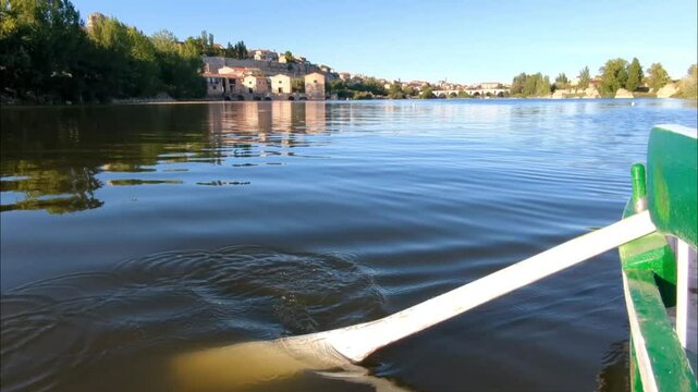 Close-up of an oar and a boat on the Duero River with the city of Zamora in the background, Zamora, Spain