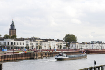 Obraz premium Skyline of Zutphen. City landscape view with Gelderland, ship on IJssel river, European building and architecture. 