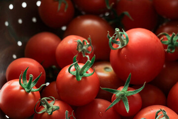 Tomatoes stacked on top of each other in a supermarket for sale, tomato texture.