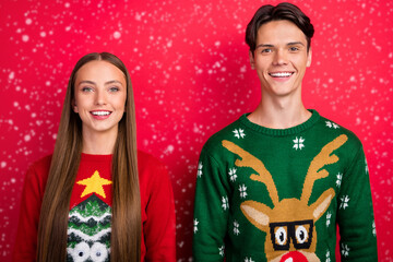 Photo of cheerful positive glad nice couple toothy beaming smile wear ugly pullover isolated red color background