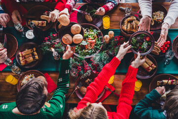 High angle view cropped photo of group family members eat food table gather celebrate christmas apartment indoors