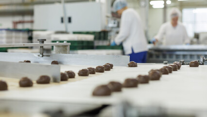 Conveyor belt with candy factory production.