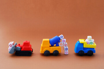 Vehicles used in the construction world (backhoe, concrete mixer and truck)