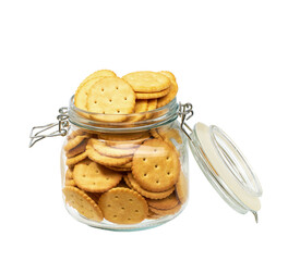 Open jar of round crackers isolated on white background.