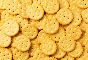 Round crackers background, crispy and crunchy round shape crackers, taken from above, close up.