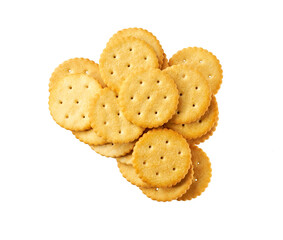 Pile of round salted crackers isolated on white background, top view.