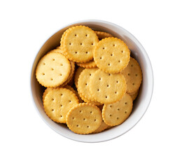 Round crackers in a bowl isolated on white background, top view.