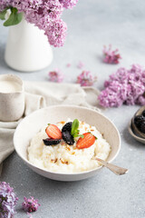 Rice porridge with milk and strawberries. A delicious homemade breakfast for the whole family. 