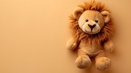 Cute stuffed lion toy on beige background. Minimalist design with copy space. Children's toy or baby product concept. Design for nursery decor, banners, marketing materials, or baby announcements.