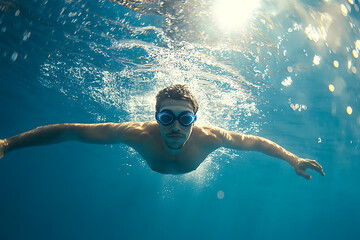 Swimming is a physical activity that enhances body strength, improves cardiovascular health, and promotes overall fitness and well-being.