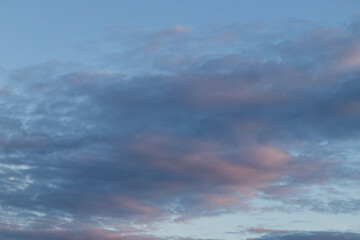 Unusual dark pink layered stratus clouds, skyscape.