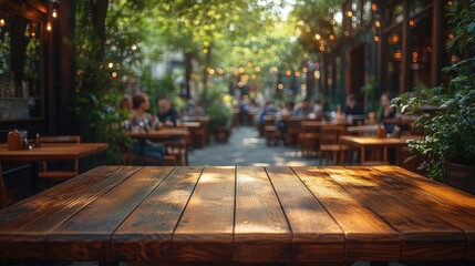 Wooden table in a modern café with a blurred background of people and greenery, ideal for lifestyle and dining themes.