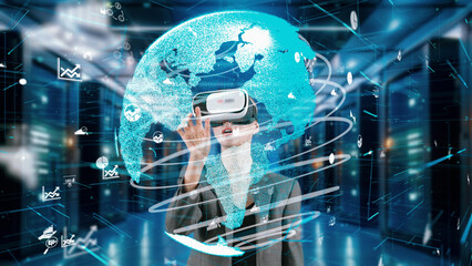 Fototapeta premium Woman selecting move data dynamic market rotate world analysis monitor by VR future global innovation interface digital infographic network technology visual hologram animation at server. Contraption.
