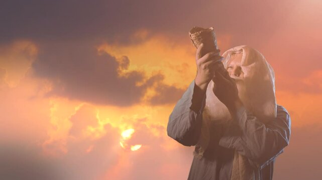 Jewish man blowing the Shofar horn of Rosh Hashanah New Year