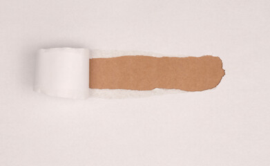 Torn, ripped paper pieces hole frame. White gray, beige brown copy space texture background