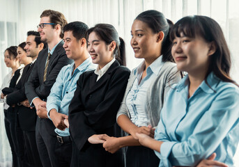 Modern diversity and multicultural company, business people joining hand together and standing in line, shared commitment to collaboration and cooperation concept background. Meticulous