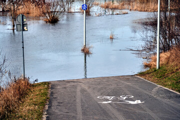 flooded bicycle path on the Warta River in the city of Poznan