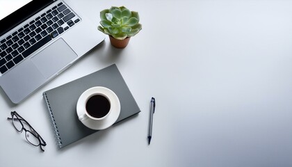 office desk with laptop, notebook, and coffee cup, placed on white background