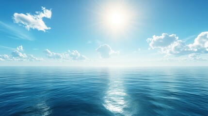 Fototapeta premium A panoramic view of the vast blue ocean under a bright, clear sky. The sun shines down, reflecting on the calm water's surface, creating a peaceful atmosphere.