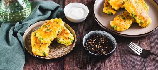 Delicious fried potato and broccoli sticks on a plate on the table web banner