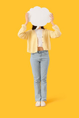 Young woman with blank speech bubble on yellow background