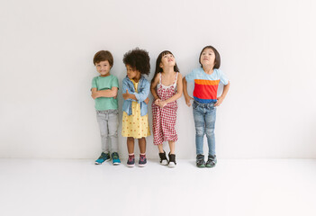 Happy multiracial school aged kids friends standing in studio portrait with smile and funny isolated on white background. Girl, boy or isolated friends for happiness.