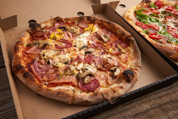 Whole pizza in a cardboard