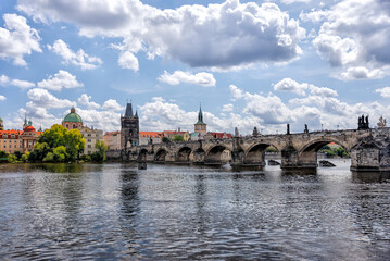 Obraz premium Prague, Czech Republic - July 19, 2024: Morning views along the Vltava River and Charles Bridge n Prague in the Czech Republic 