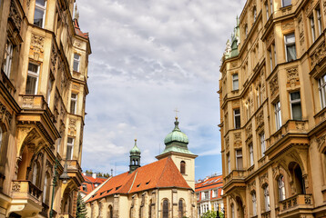 Obraz premium Prague, Czech Republic - July 16, 2024: Classic residential buildings in the old town of Prague in the Czech Republic 