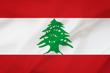 Lebanon flag on waving silk background. Fabric texture. National icon of Lebanon.